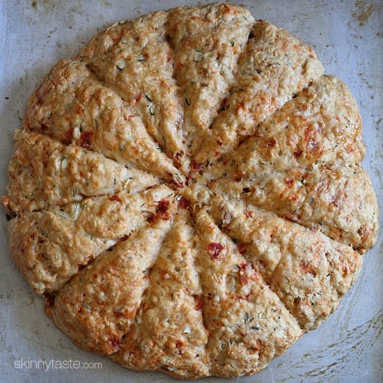 Light and biscuit-like savory scones made with a blend of whole wheat and white flour, shredded zucchini, sun dried tomato, Asiago cheese and fresh rosemary.