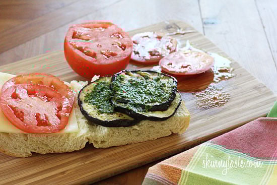 A perfect summer lunch panini made with eggplant, tomatoes, mozzarella and skinny pesto on crispy French bread. Make this for one, or for the whole family.