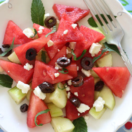 Chilled Watermelon Cucumber Feta Salad tossed with Kalamata olives, fresh mint and a drizzle of balsamic glaze – refreshing, light and delicious!
