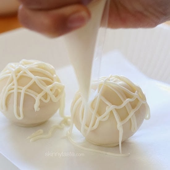 Easy Skinny Halloween mummy cake balls made light by using a box cake mix, egg whites and fat free Greek yogurt – no butter required!