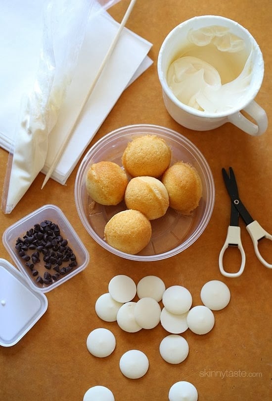 Easy Skinny Halloween mummy cake balls made light by using a box cake mix, egg whites and fat free Greek yogurt – no butter required!