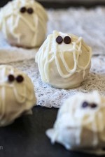 Easy Skinny Halloween mummy cake balls made light by using a box cake mix, egg whites and fat free Greek yogurt – no butter required!