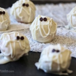 Easy Skinny Halloween mummy cake balls made light by using a box cake mix, egg whites and fat free Greek yogurt – no butter required!