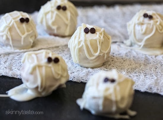 Easy Skinny Halloween mummy cake balls made light by using a box cake mix, egg whites and fat free Greek yogurt – no butter required!