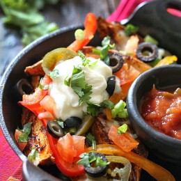These Irish style baked sweet potato wedges are topped with my favorite nacho toppings and they are dangerously good!!