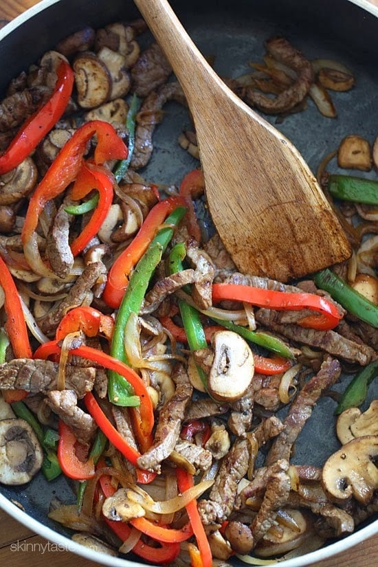 Quick skillet steak with onions, peppers, mushrooms loaded on top of a baked potato and topped with melted cheese – this loaded Philly cheesesteak baked potato is perfect for the meat and potato lover in your life!