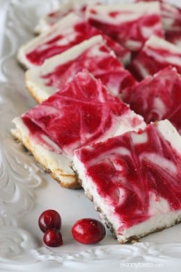 Cranberry Swirl Cheesecake Squares with a gingersnap pecan crust – so good, less guilt and perfect for the Holidays!