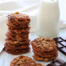 These delicious dark chocolate oatmeal lace cookies are light, crisp and chewy, sandwiched together with melted dark chocolate.