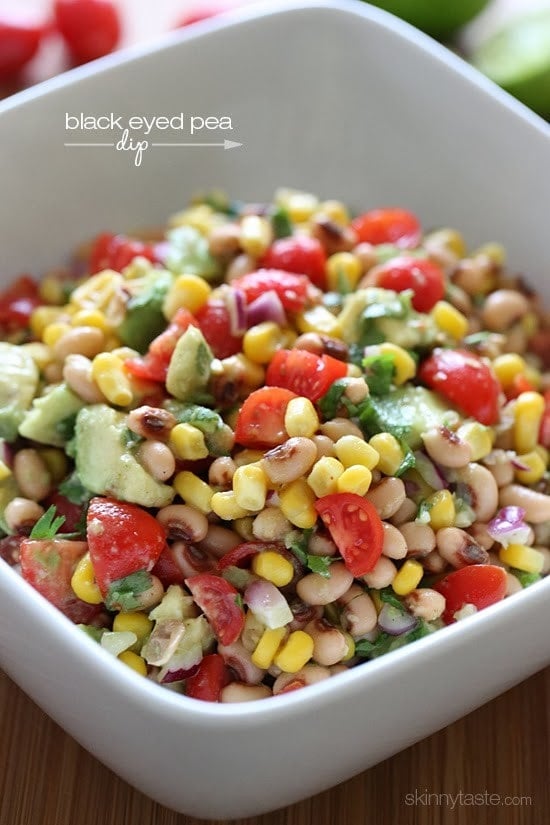 Black-eyed Pea Dip A bowl of black-eyed peas mixed with tomatoes, corn, avocado, and fresh cilantro