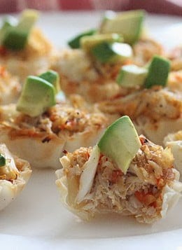 Quick and easy crab and avocado phyllo bites! These bite sized appetizers filled with fresh lump crab meat are the perfect finger food treat to any party.
