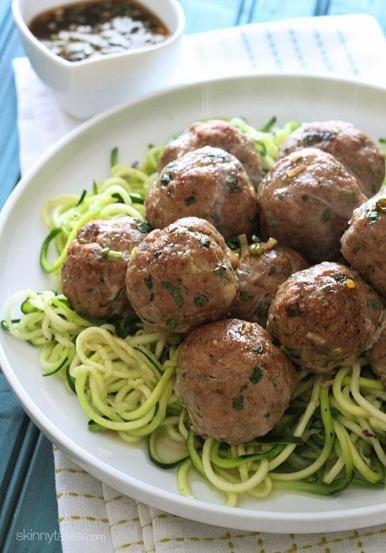 These Asian inspired meatballs are out of this world! Made with ground turkey, ginger, scallions, cilantro and sesame oil with a tangy sesame-lime dipping sauce