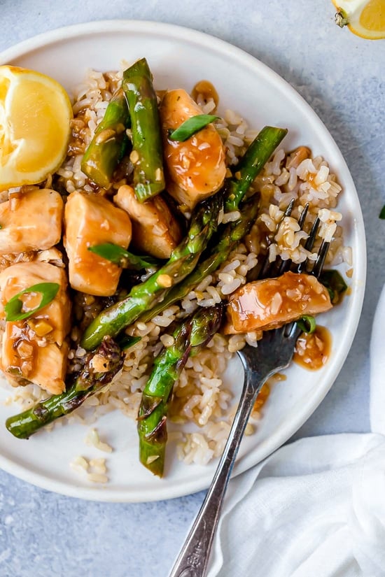 This quick weeknight Chicken and Asparagus Lemon Stir Fry is perfect for spring, made with lean chicken breast, asparagus, fresh lemon, garlic and ginger.