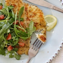 Breaded flounder milanese, lightly pan sauteed and topped with an arugula, lemon and tomatoes – a simple yet delicious way to prepare fish. Perfect for Lent, or any night you're in the mood for fish.