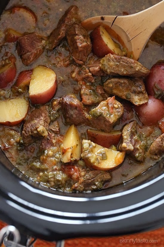 Crock pot carne guisada is a slow cooked Latin beef stew with baby red potatoes and Latin seasonings. Serve this topped with fresh aji picante – it's a must and really brightens the flavors and rounds out the dish!