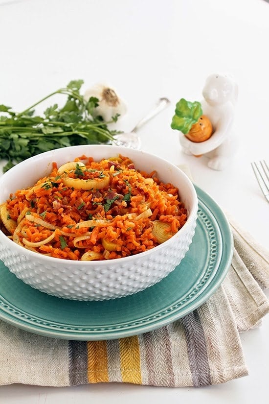 While you dig your fork into this fluffy bowl of spiralized carrot "rice" leek risotto with bacon, you won’t believe it’s not real rice.