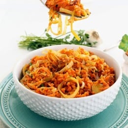 While you dig your fork into this fluffy bowl of spiralized carrot "rice" leek risotto with bacon, you won’t believe it’s not real rice.