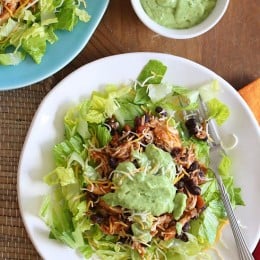 This simple slow cooker chicken taco salad is high in fiber and protein which means it's very satisfying – all for under 300 calories. Trust me, you won't miss the tortillas!