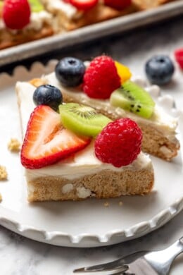 Two fruit pizza pieces on plate