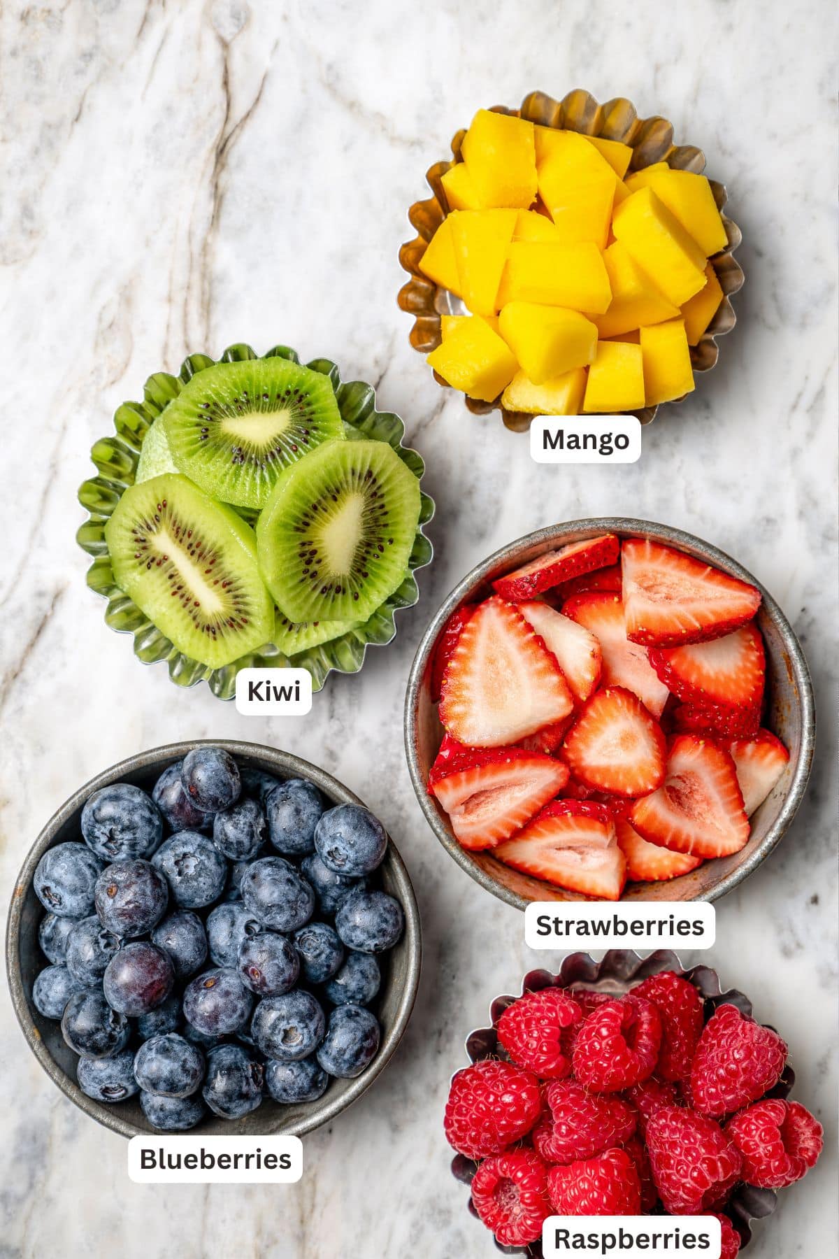 Overhead view of fruit for fruit pizza