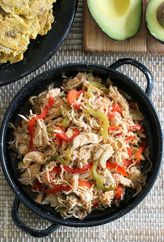 This Cuban inspired dish is made with shredded chicken breast cooked in the slow cooker, then sauteed with bell peppers, onions, cumin and lots of Latin flavor! If you have leftover rotisserie chicken, you can use that instead and skip the slow cooker!
