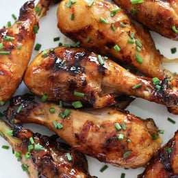 These sweet 'n spicy Asian glazed grilled drumsticks are finger licking good! An inexpensive, weeknight dish you'll want to make all summer long!