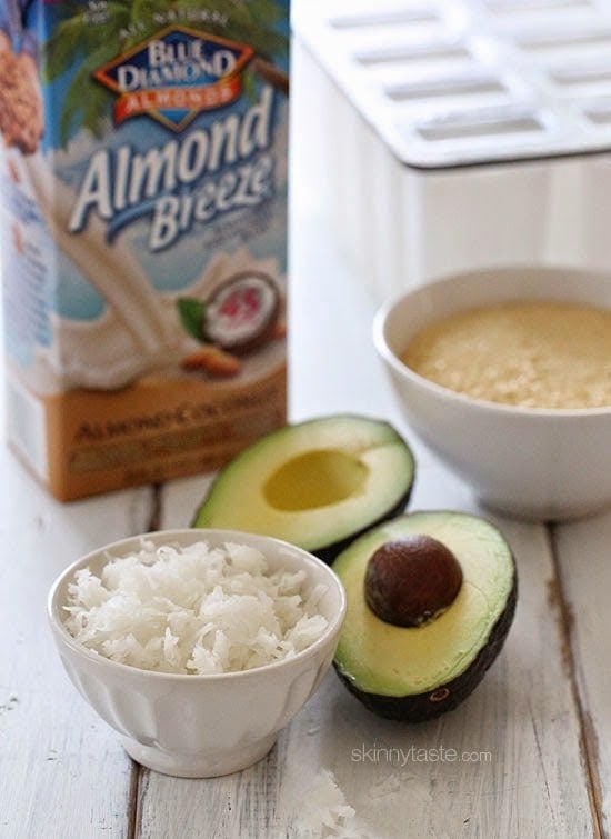 These creamy avocado coconut popsicles are made with just 4 ingredients – nutrient dense avocados, coconut-almond milk, raw sugar and coconut flakes.