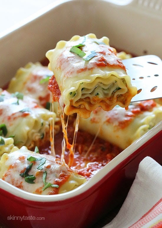 These EASY lasagna rolls are stuffed with zucchini, ricotta and Parmesan, then topped with marinara and mozzarella cheese – delicious, kid friendly and perfect if you want to feed a crowd.