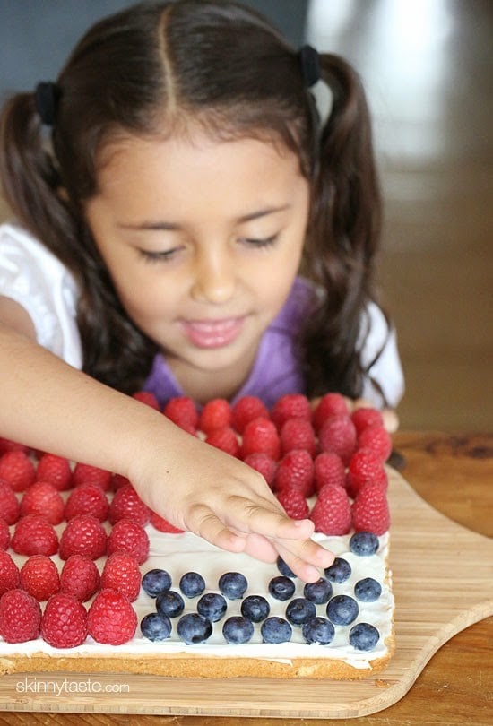 Red, White and Blue fruit "pizza" is more like a cookie bar, topped with cream cheese frosting and fruit.