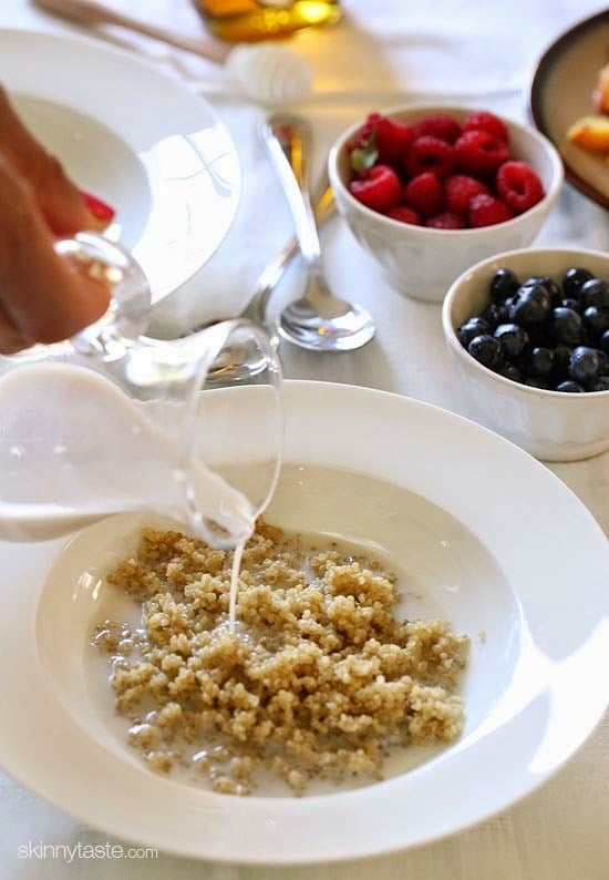 These Summer Quinoa Breakfast Bowls are my favorite! Served as a warm cereal topped with fresh fruit and a drizzle of honey. A healthy protein packed breakfast.