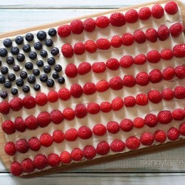 Red, White and Blue fruit "pizza" is more like a cookie bar, topped with cream cheese frosting and fruit – The perfect 4th of July dessert!