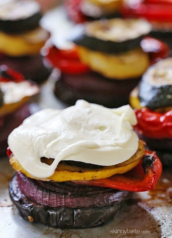 Grilled Veggie Towers with Mozzarella Grilled Vegetable Towers with Mozzarella are layered with grilled, marinated eggplant, zucchini, yellow squash, red onion and bell peppers topped with fresh mozzarella.