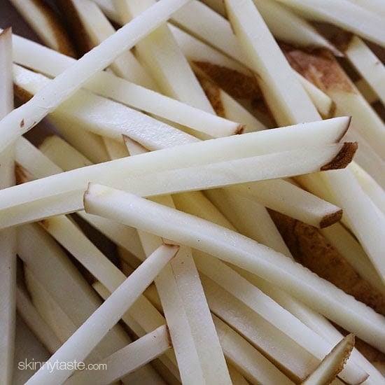 These delicious fries are baked in the oven with garlic, a little olive oil, kosher salt and black pepper, then sprinkled with freshly grated Parmesan and parsley – to die for!