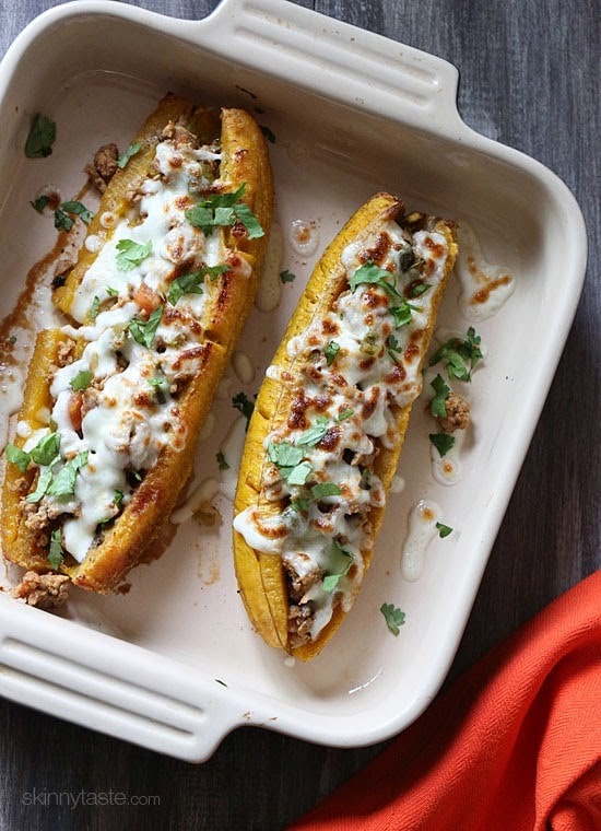 These sweet plantains are baked in the oven and then stuffed with a savory turkey picadillo filling and topped with cheese – pretty hard to resist! 
