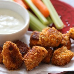 Healthy, Buffalo Chicken Nuggets baked in the oven are spicy and delicious! Crispy and golden on the outside with tender chicken breast on the inside, so good!