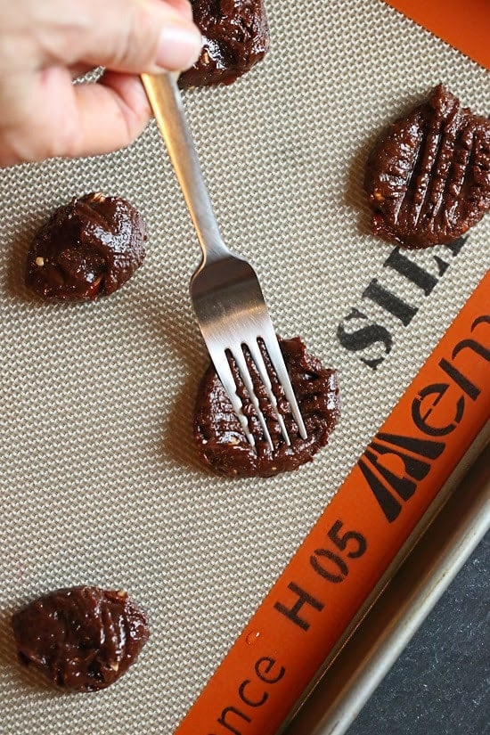 These cookies are amazing!!! And so easy to make, you don't even need a mixer! Only 5 ingredients including Nutella, Chunky Almond Butter and Cocoa Powder.