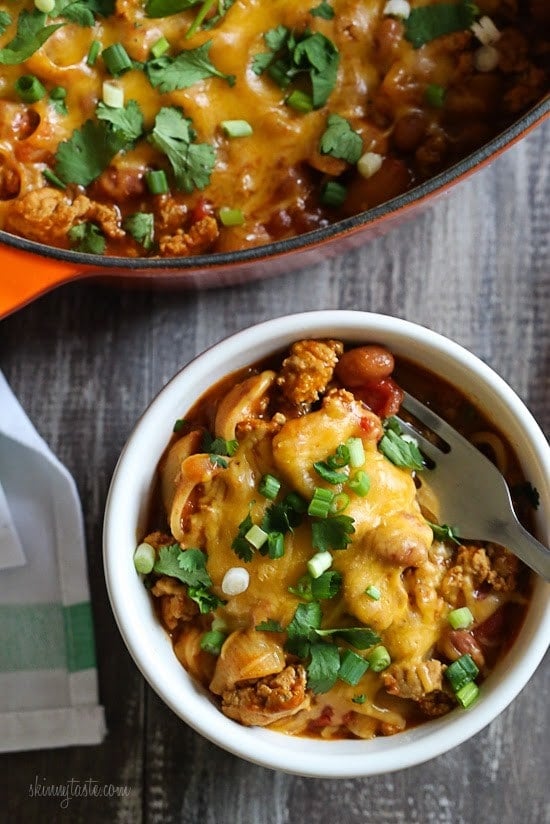 One Pot Cheesy Turkey Taco Chili Mac recipe is so easy and protein packed! Made with taco seasoning, beans, and pasta shells topped with cheese is a favorite in my home! Bonus points for dirtying only one pot!
