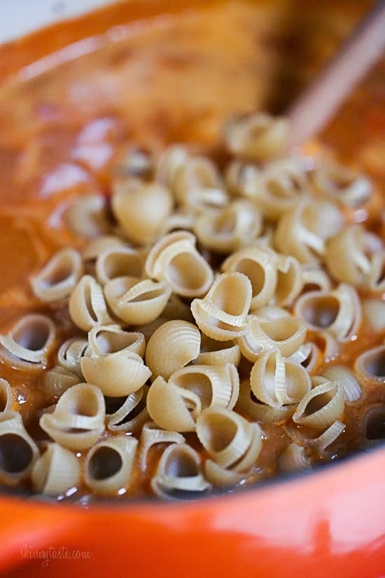Taco Chili Mac recipe is so easy and protein packed! Made with taco seasoning, beans, and pasta shells topped with cheese is a favorite in my home!