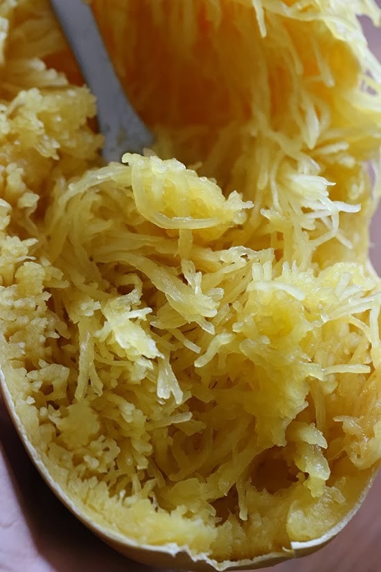 Spaghetti Squash Primavera is made with fresh vegetables simmered with a quick marinara sauce and topped with fresh mozzarella – easy, cheap, gluten-free and perfect for Meatless Mondays!