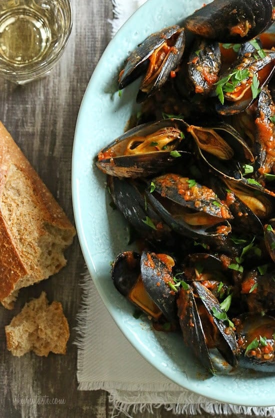 Mussels in a spicy red marinara sauce – simple and elegant, best served with lots of whole wheat crusty bread for dipping into the delicious sauce.