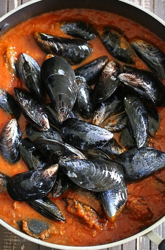 Mussels in a spicy red marinara sauce – simple and elegant, best served with lots of whole wheat crusty bread for dipping into the delicious sauce.