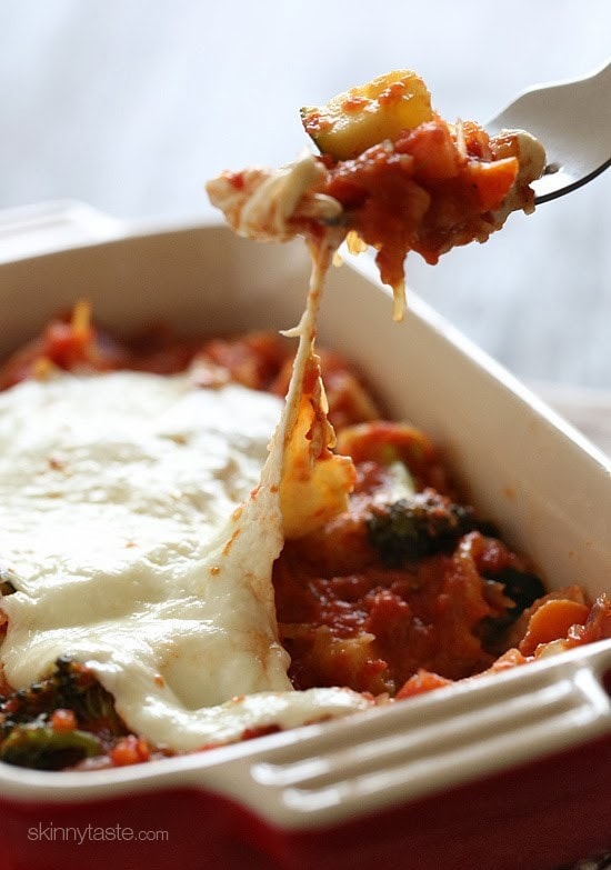 Spaghetti Squash Primavera is made with fresh vegetables simmered with a quick marinara sauce and topped with fresh mozzarella – easy, cheap, gluten-free and perfect for Meatless Mondays!