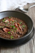 A black bowl of turkey bean soup