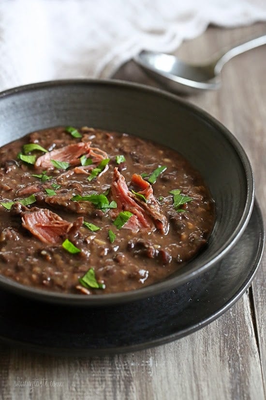 A black bowl of turkey bean soup