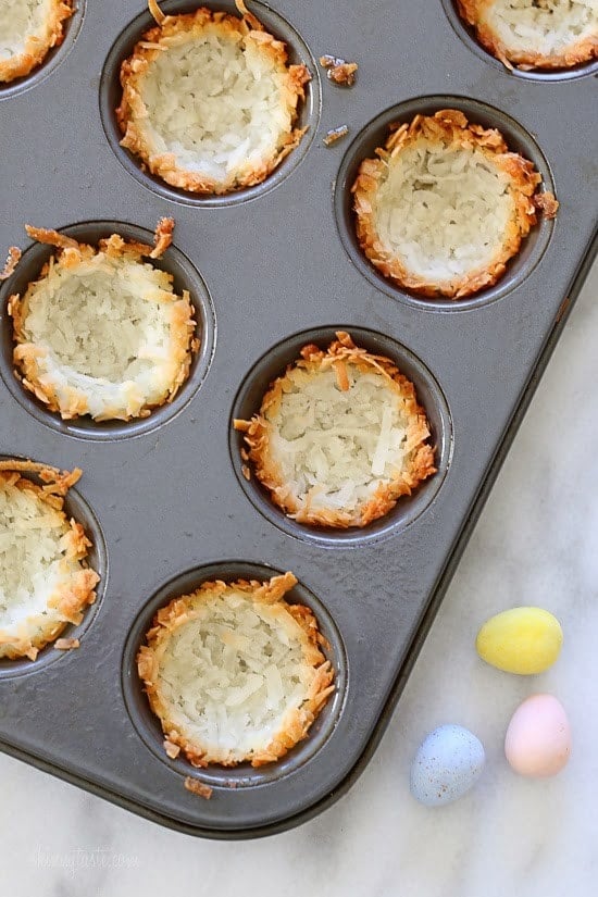 Coconut Macaroon Nests Easy gluten free coconut macaroons shaped like a bird's nest, filled with mini chocolate Cadbury eggs – a tasty Easter treat!