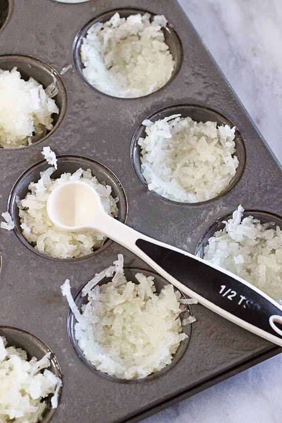 Easy gluten free coconut macaroons shaped like a bird's nest, filled with mini chocolate Cadbury eggs – a tasty Easter treat!