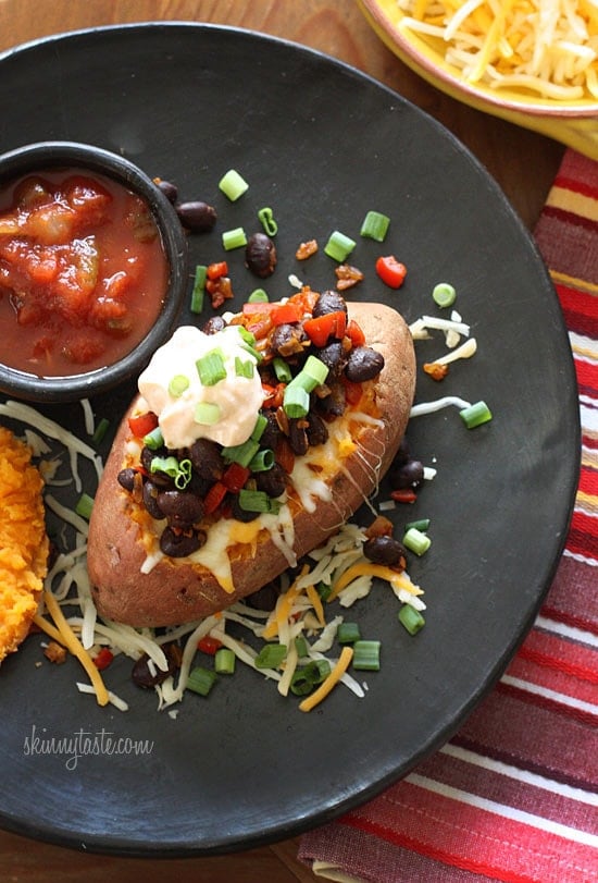 Loaded Vegetarian Baked Sweet Potato Loaded Vegetarian Baked Sweet Potato are Mexican-inspired, loaded with zesty black beans, melted cheese, salsa with a dollop of cream. What can be better than a 20 minute meal!