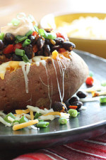 Loaded Vegetarian Baked Sweet Potato are Mexican-inspired, loaded with zesty black beans, melted cheese, salsa with a dollop of cream. What can be better than a 20 minute meal!