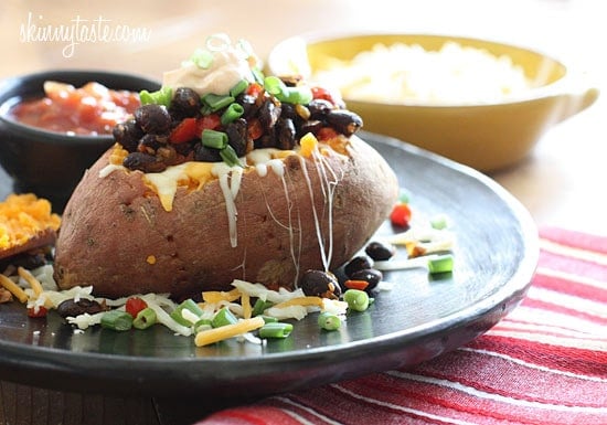Loaded Vegetarian Baked Sweet Potato are Mexican-inspired, loaded with zesty black beans, melted cheese, salsa with a dollop of cream. What can be better than a 20 minute meal!