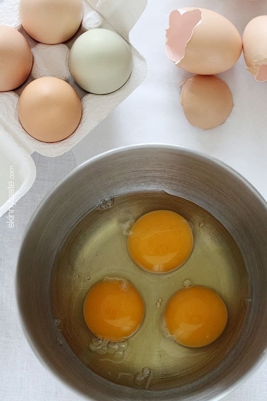 Cracking eggs in the bowl.