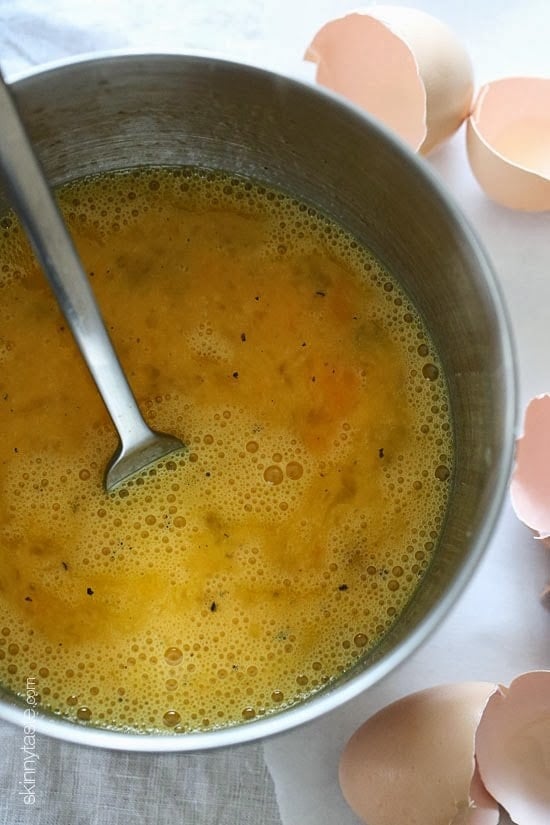 Preparing and seasoning egg mix.